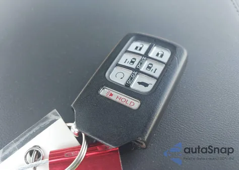 2022 Honda Odyssey Touring z USA, uszkodzony, nr VIN 5FNRL6H8XNB057620